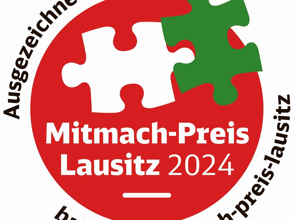 Logo mit rotem Kreis und zwei Puzzleteilen, eins weiß, eins grün.